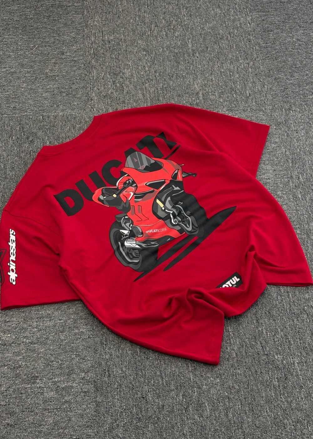 Red Ducati Racing Oversized T-Shirt Featuring Rider Illustration and Alpinestars Logo